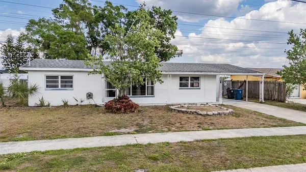 a view of a house with a yard