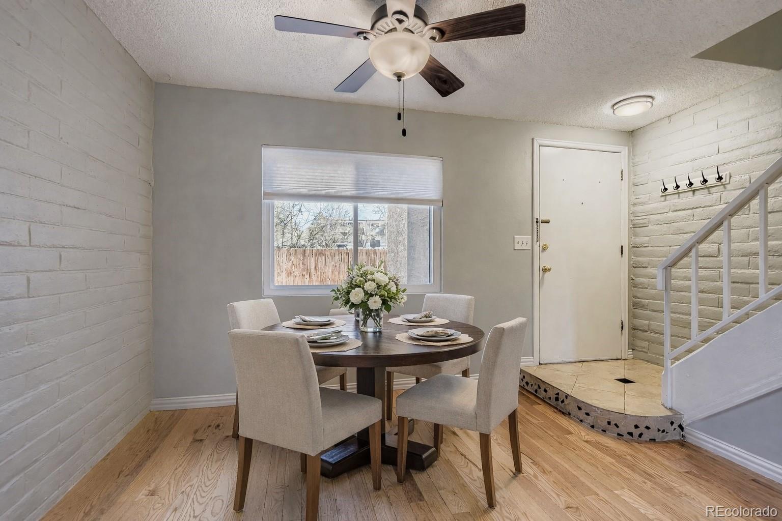 1060 South Parker Road, Unit 25 Denver, CO 80231 - Photo 5 of 26 a dining room with furniture and window