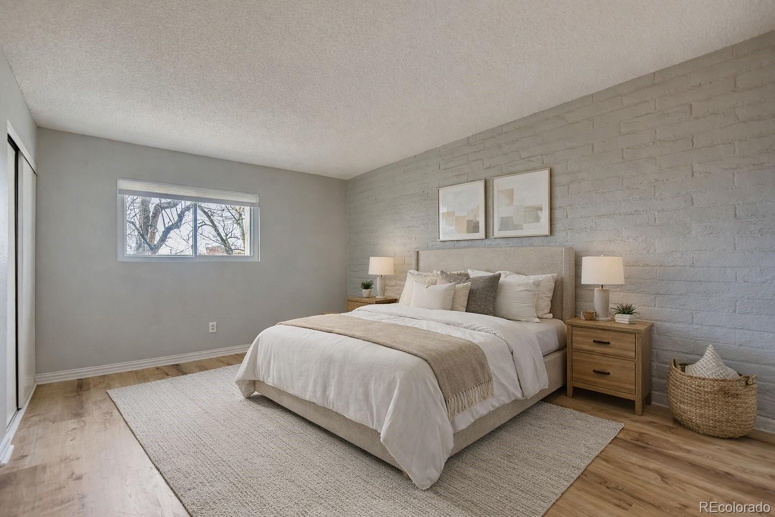 1060 South Parker Road, Unit 25 Denver, CO 80231 - Photo 9 of 26 a bedroom with a bed and a window