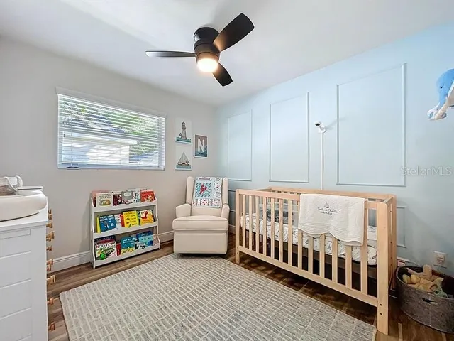 a bedroom with furniture and a window