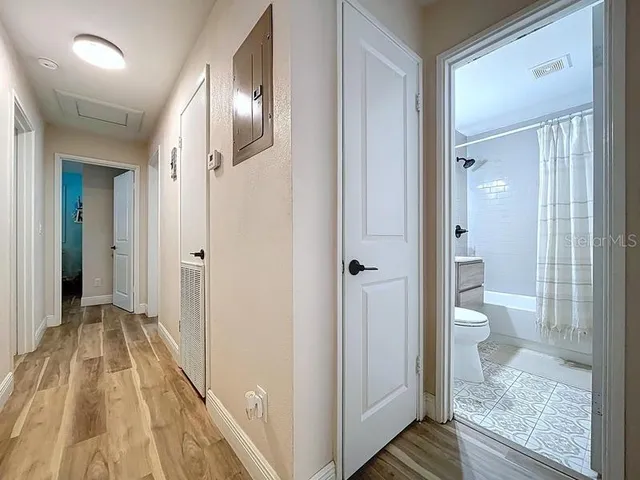a bathroom with a sink a mirror and a shower