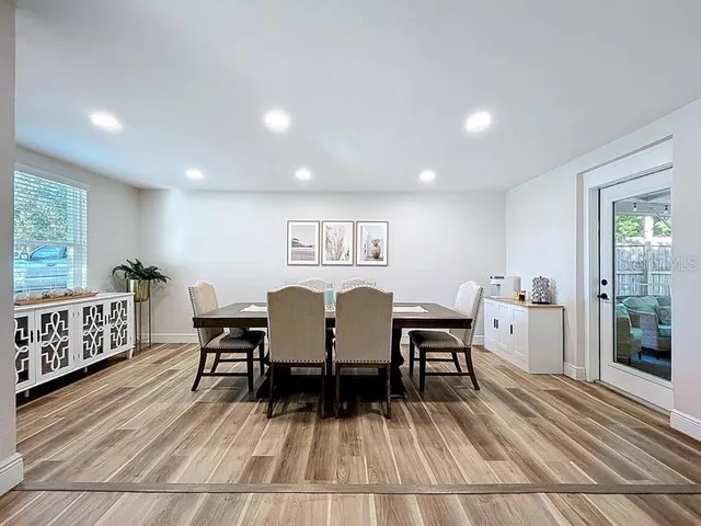 a view of a dining room with furniture window and wooden floor