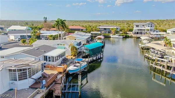 an aerial view of a house with a lake view
