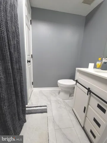 a bathroom with a toilet and a sink