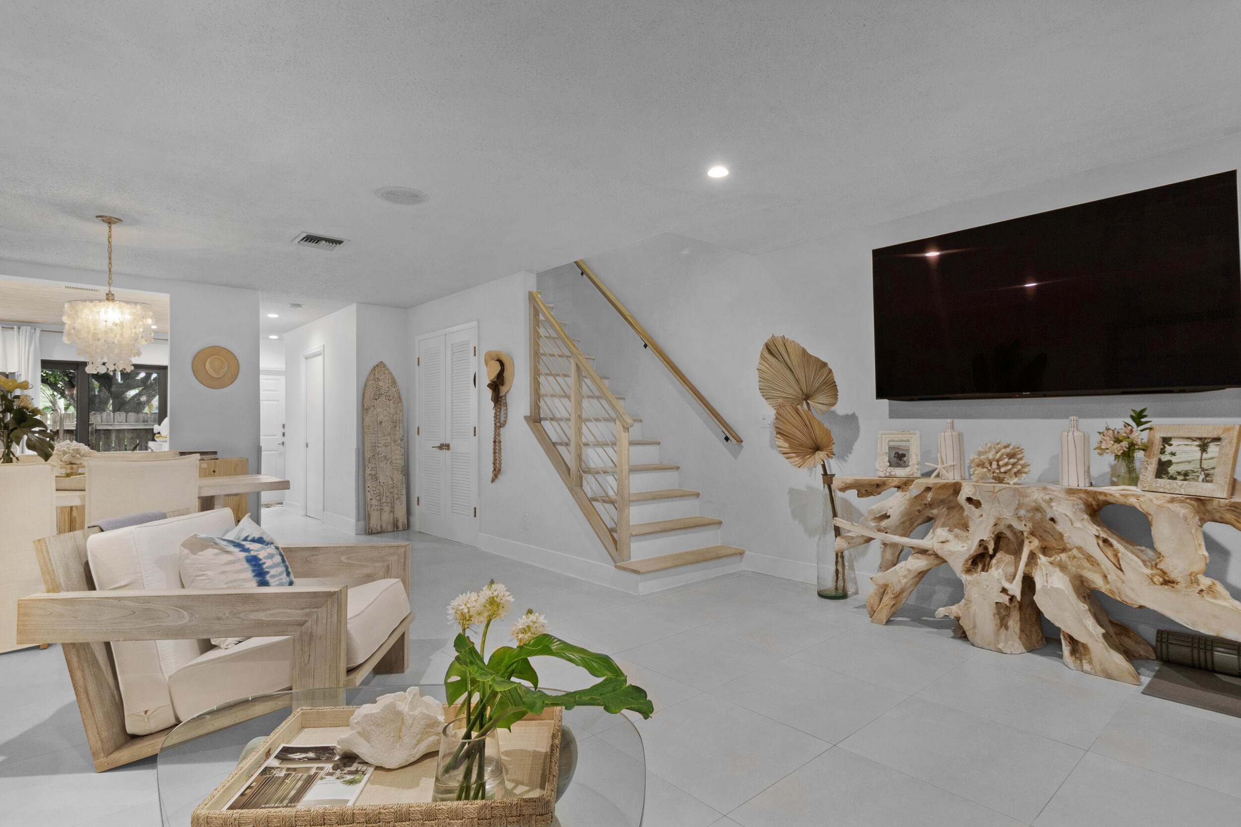 2136 Northeast 44th Street, Unit 4 Lighthouse Point, FL 33064 - Photo 17 of 51 a living room with furniture and a flat screen tv