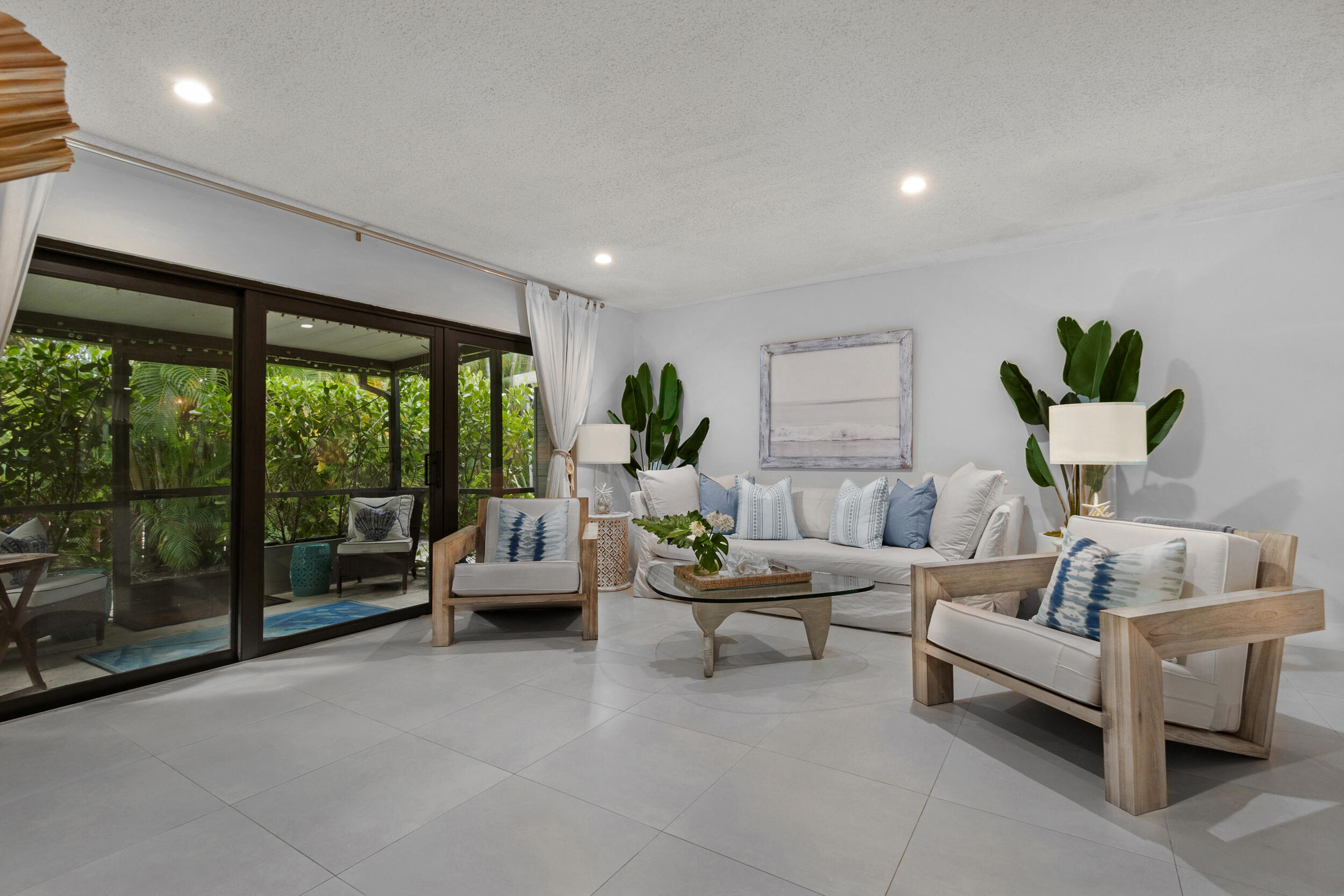 2136 Northeast 44th Street, Unit 4 Lighthouse Point, FL 33064 - Photo 18 of 51 a living room with furniture and a floor to ceiling window