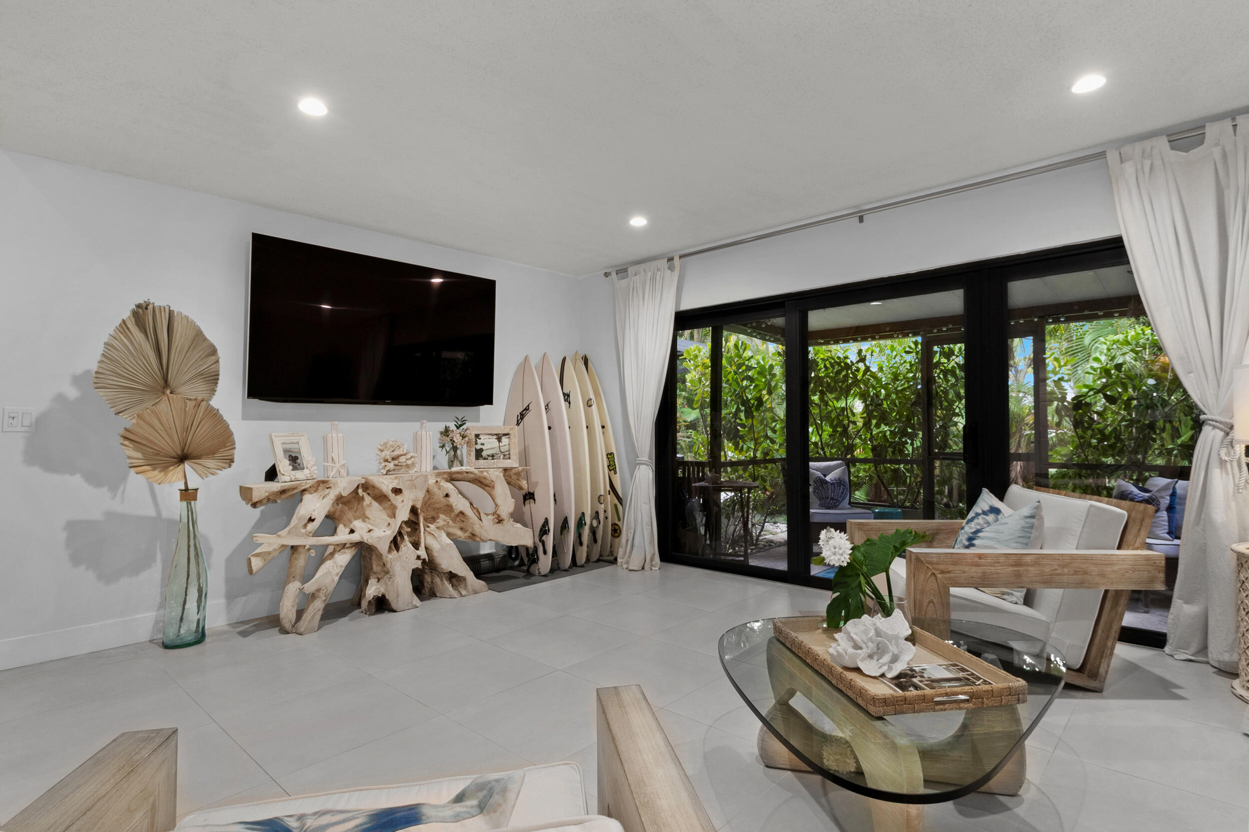 2136 Northeast 44th Street, Unit 4 Lighthouse Point, FL 33064 - Photo 19 of 51 a bedroom with furniture and a flat screen tv