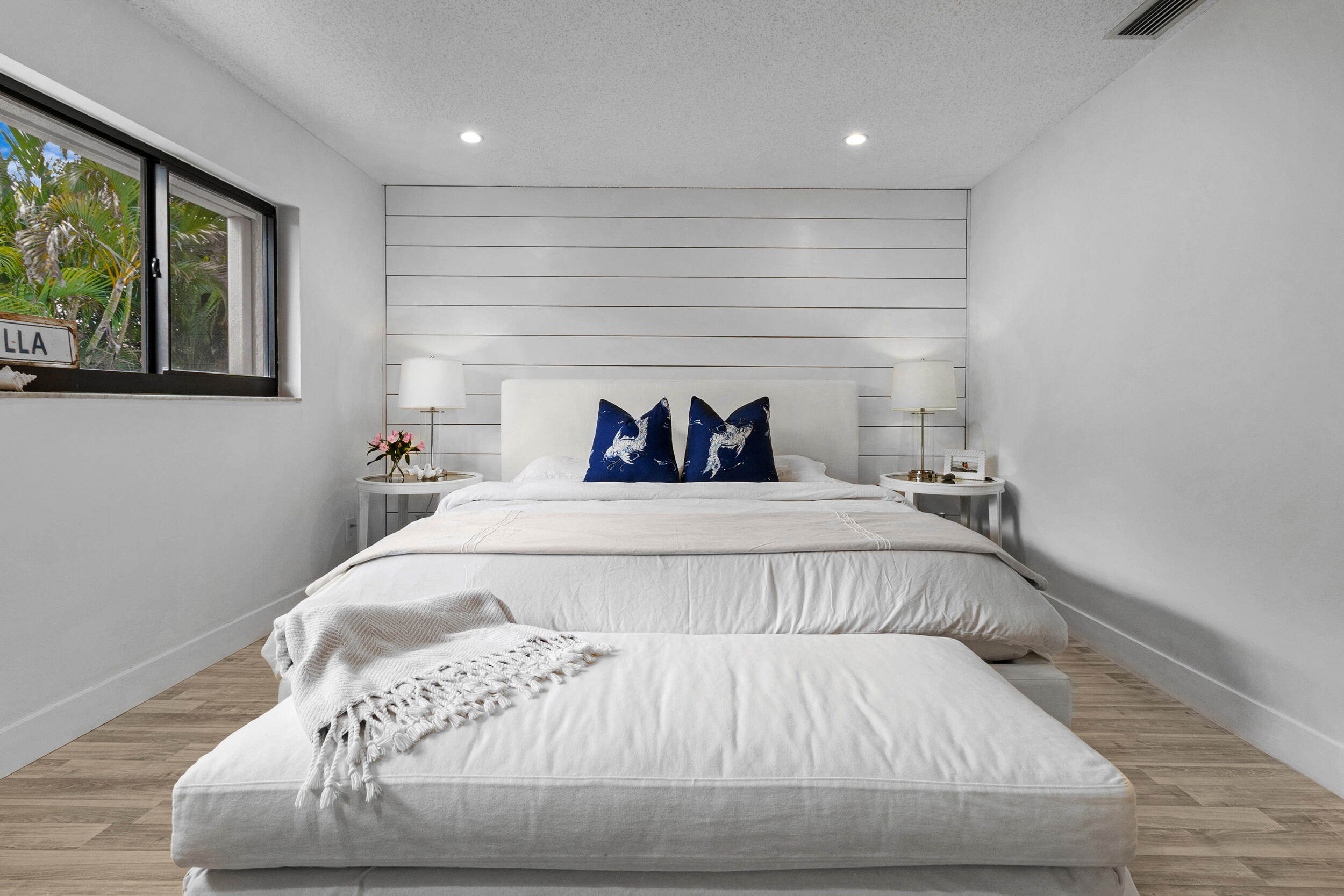 2136 Northeast 44th Street, Unit 4 Lighthouse Point, FL 33064 - Photo 28 of 51 a bedroom with a bed and window