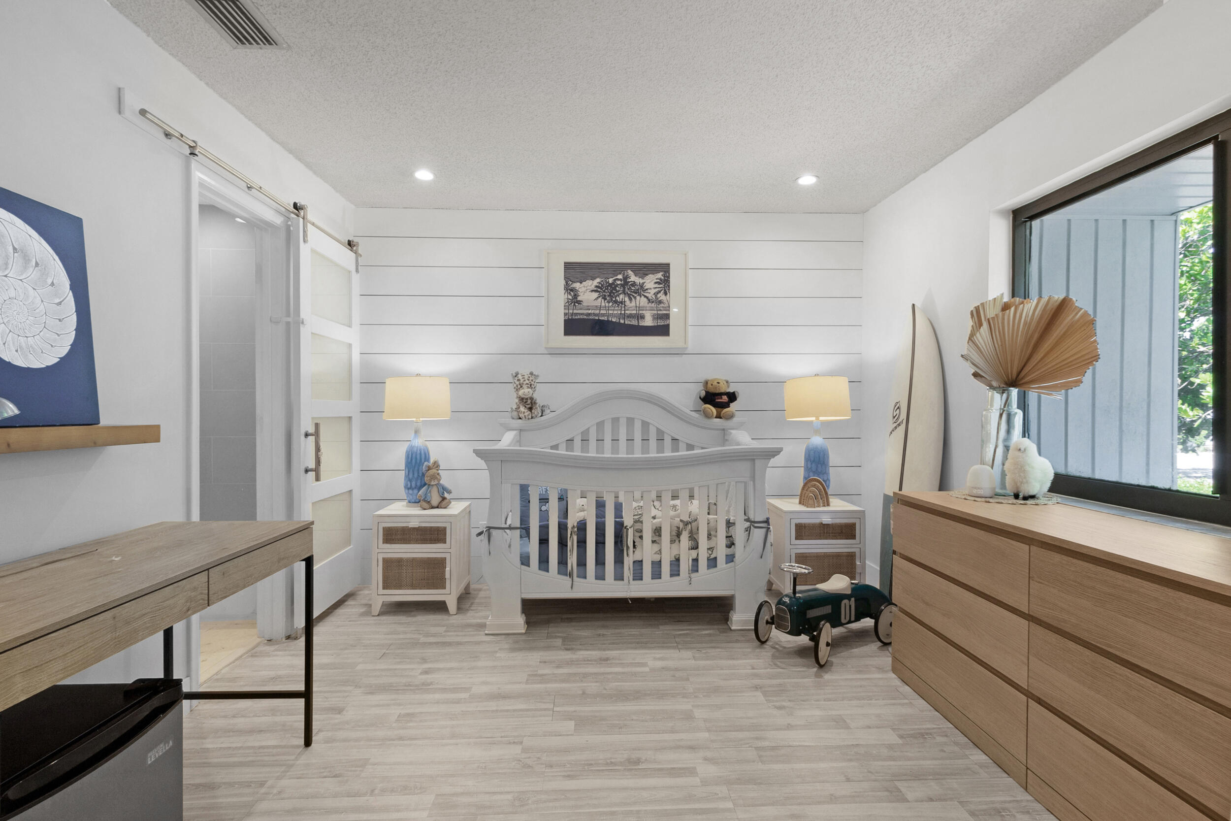 2136 Northeast 44th Street, Unit 4 Lighthouse Point, FL 33064 - Photo 39 of 51 a bedroom with furniture and a wooden floor