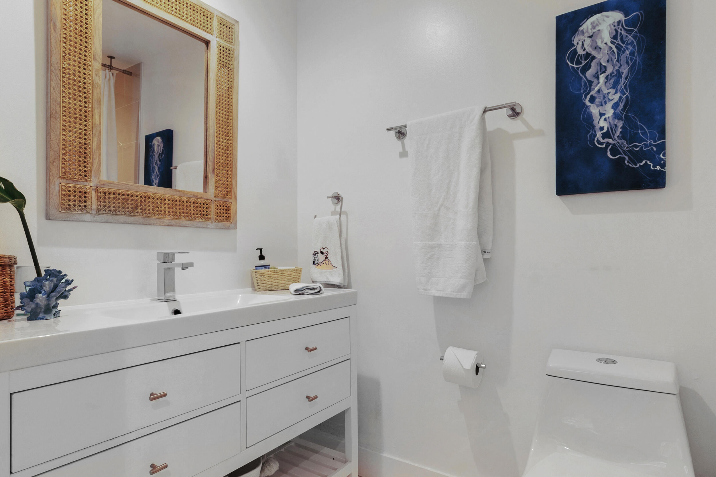 2136 Northeast 44th Street, Unit 4 Lighthouse Point, FL 33064 - Photo 40 of 51 a bathroom with a sink and a mirror