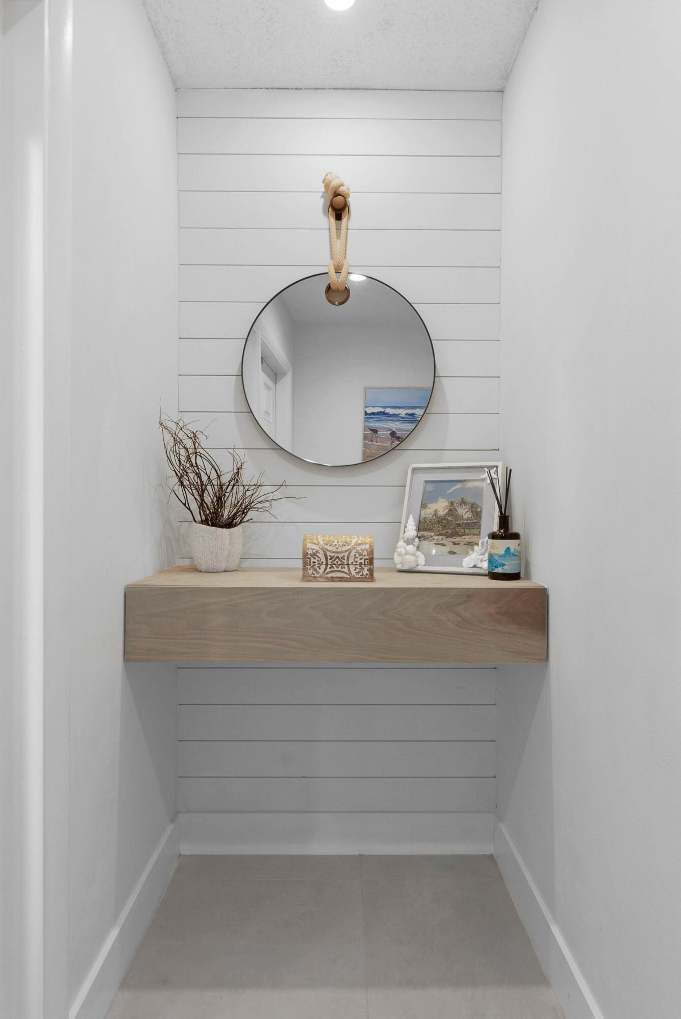 2136 Northeast 44th Street, Unit 4 Lighthouse Point, FL 33064 - Photo 4 of 51 a bathroom with a sink and a mirror