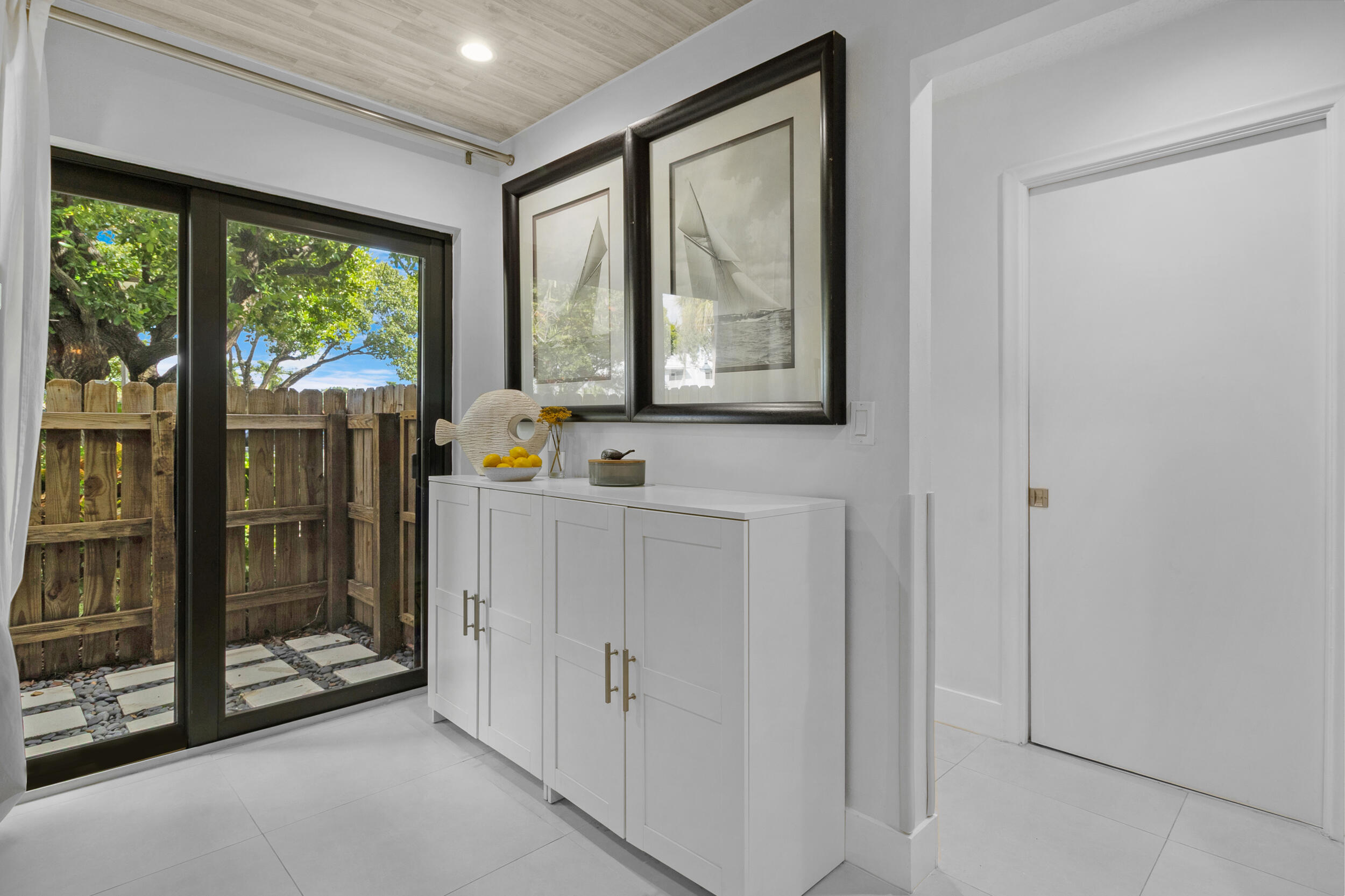 2136 Northeast 44th Street, Unit 4 Lighthouse Point, FL 33064 - Photo 8 of 51 a view of an entryway with wooden floor and door