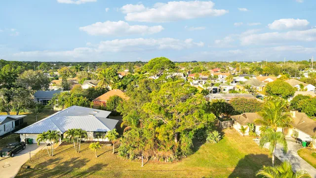 an aerial view of residential houses with outdoor space