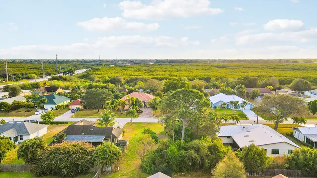 an aerial view of residential houses with outdoor space