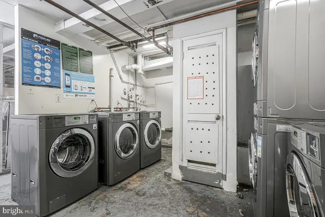 a view of a storage & utility room with washer and dryer