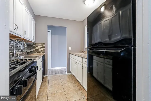 a kitchen with a stove and a microwave