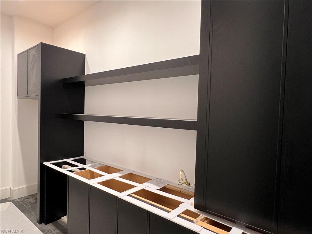 944 Chimney Rock Road Naples, FL 34120 - Photo 10 of 20 a storage room with wooden floor