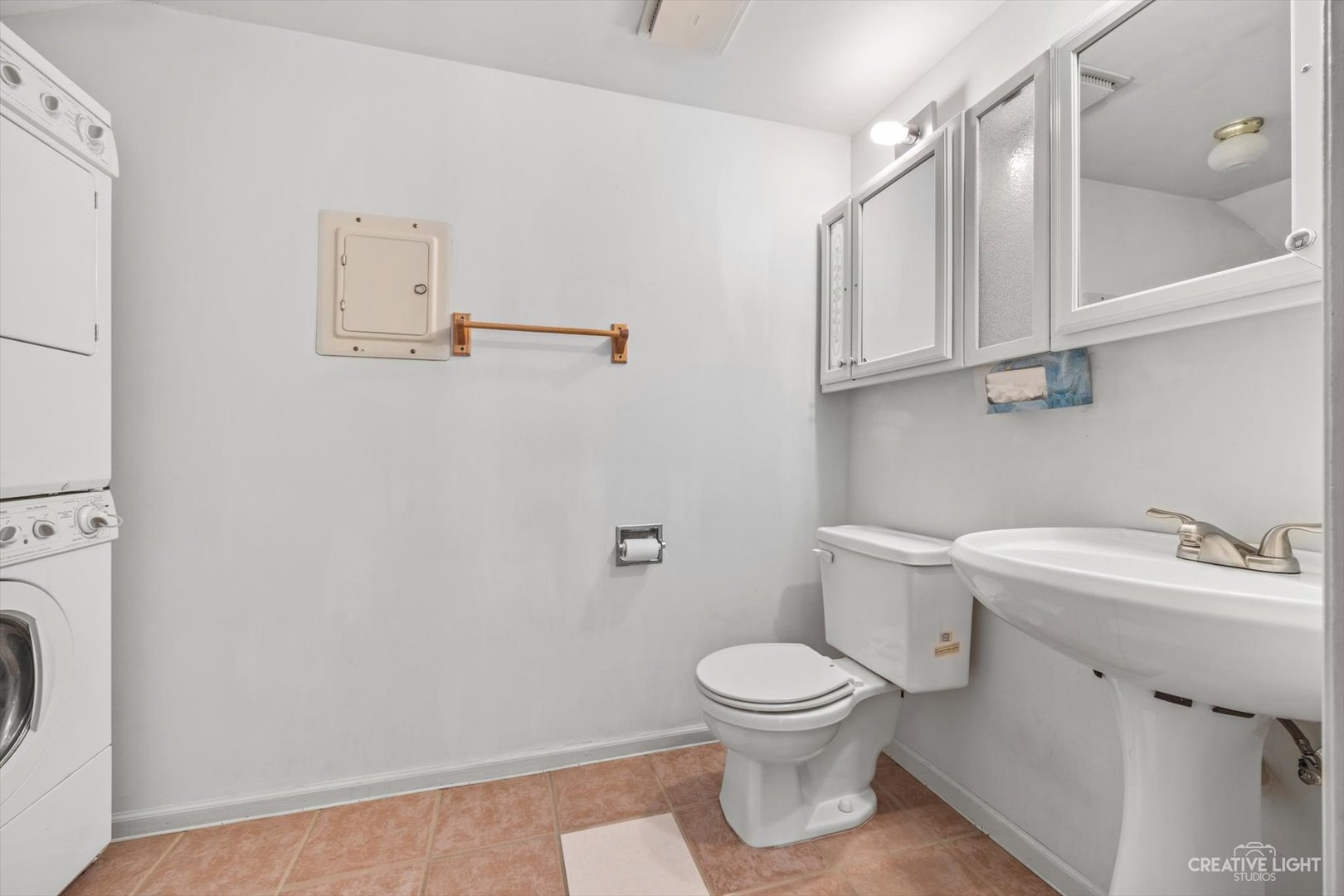 1520 Timber Trail, Unit 17B Wheaton, IL 60189 - Photo 12 of 17 a white toilet sitting next to a bathroom sink