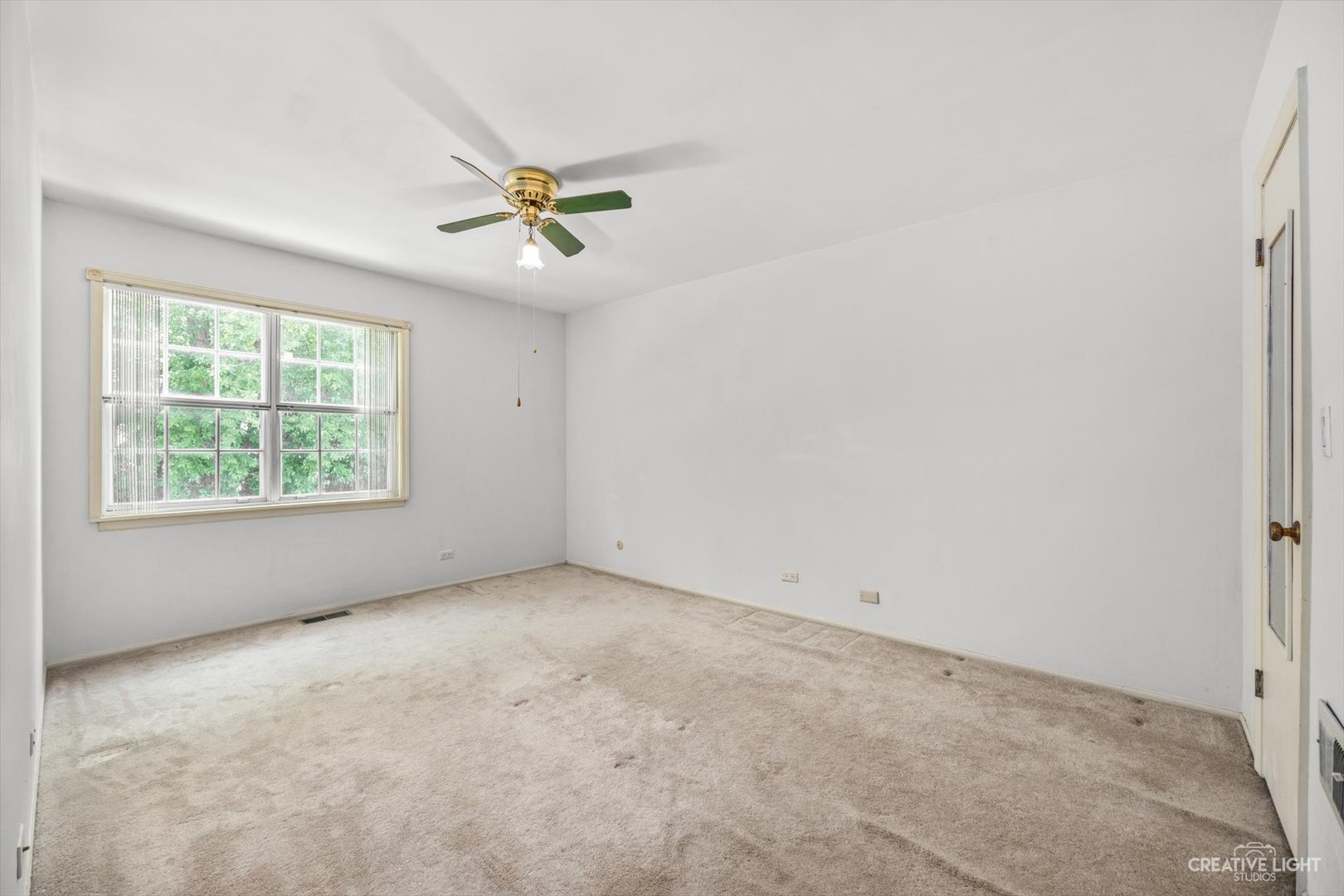 1520 Timber Trail, Unit 17B Wheaton, IL 60189 - Photo 14 of 17 an empty room with windows and ceiling fan view