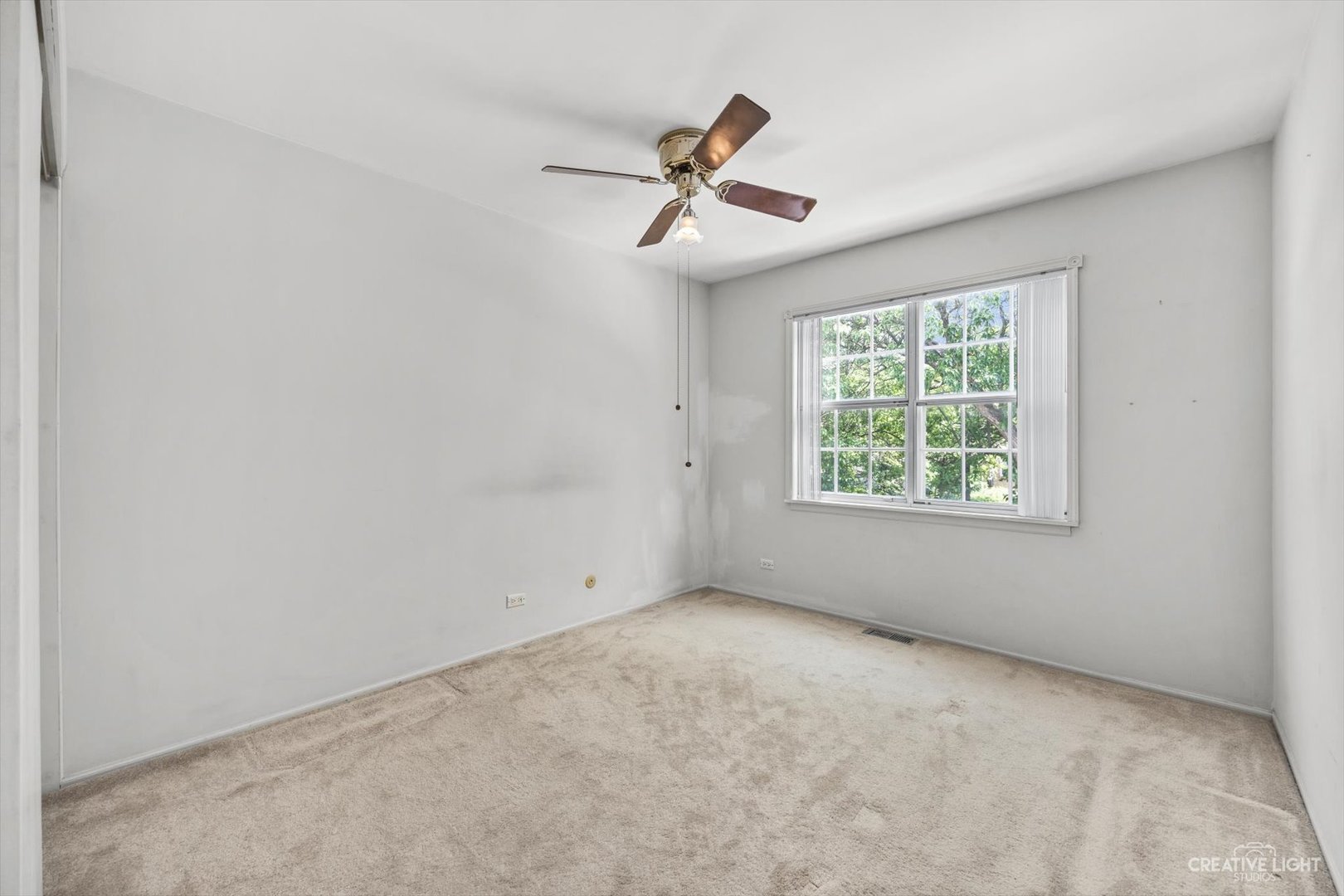 1520 Timber Trail, Unit 17B Wheaton, IL 60189 - Photo 16 of 17 an empty room with a window