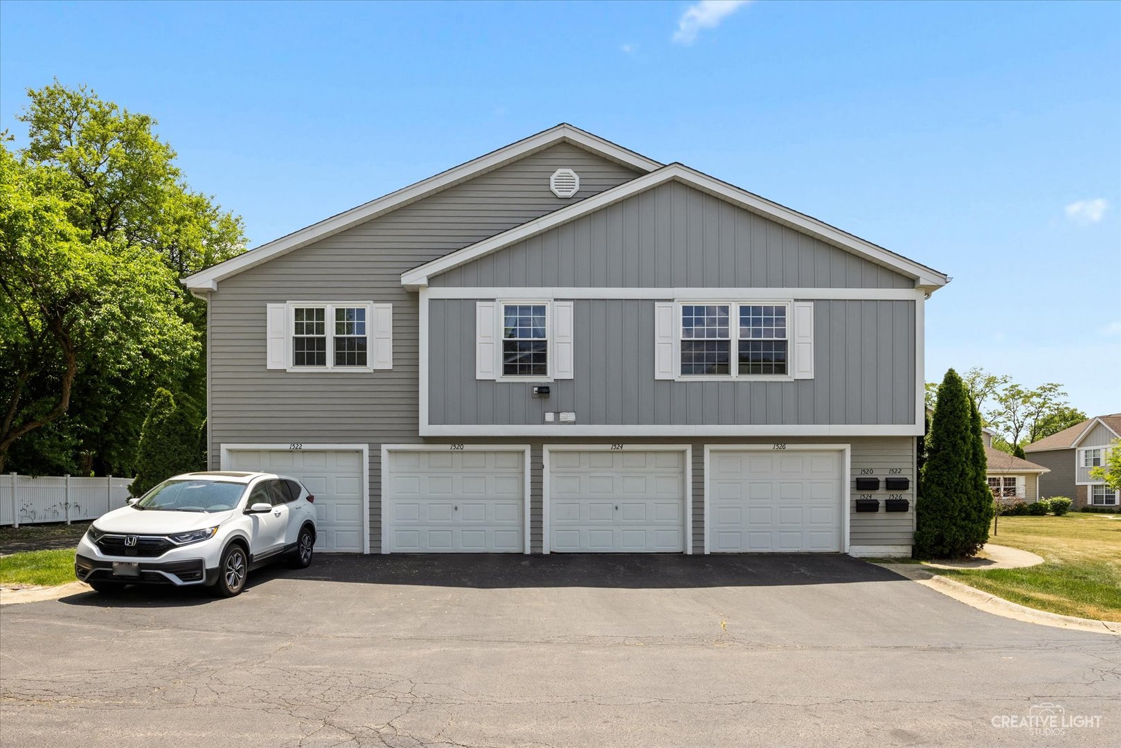 1520 Timber Trail, Unit 17B Wheaton, IL 60189 - Photo 2 of 17 a car parked in front of a house