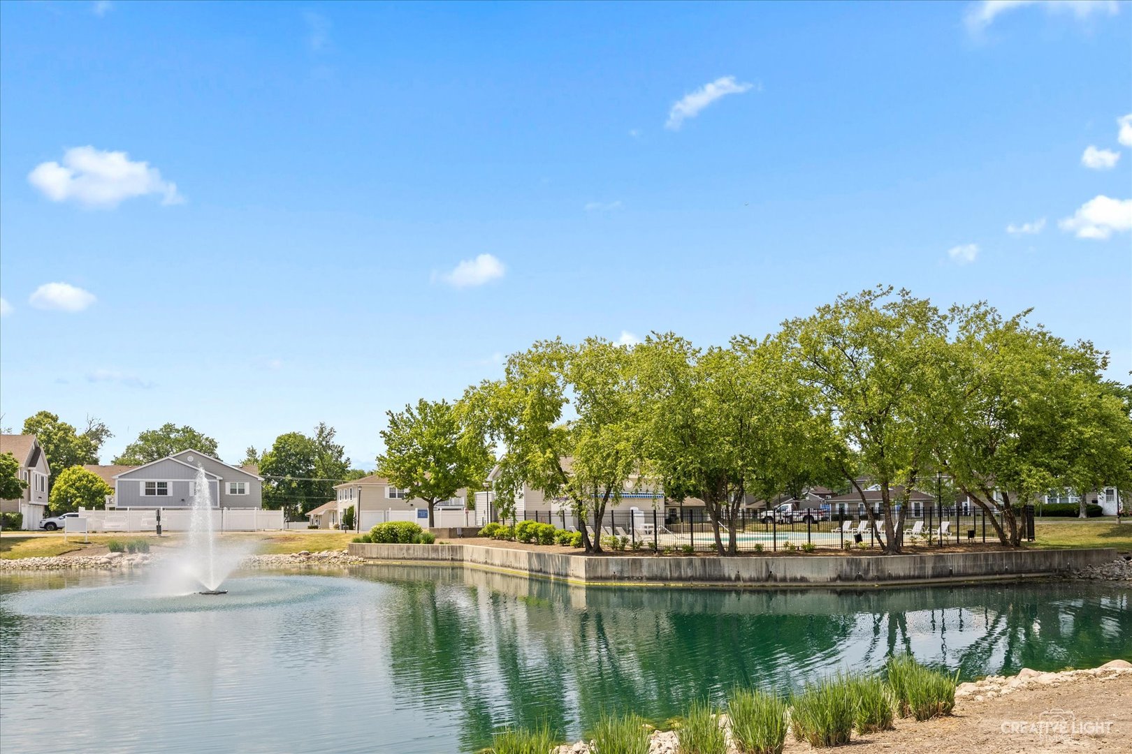 1520 Timber Trail, Unit 17B Wheaton, IL 60189 - Photo 3 of 17 a view of a lake with houses
