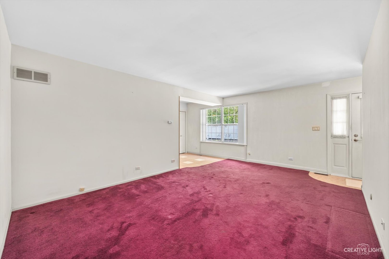 1520 Timber Trail, Unit 17B Wheaton, IL 60189 - Photo 5 of 17 an empty room with a window