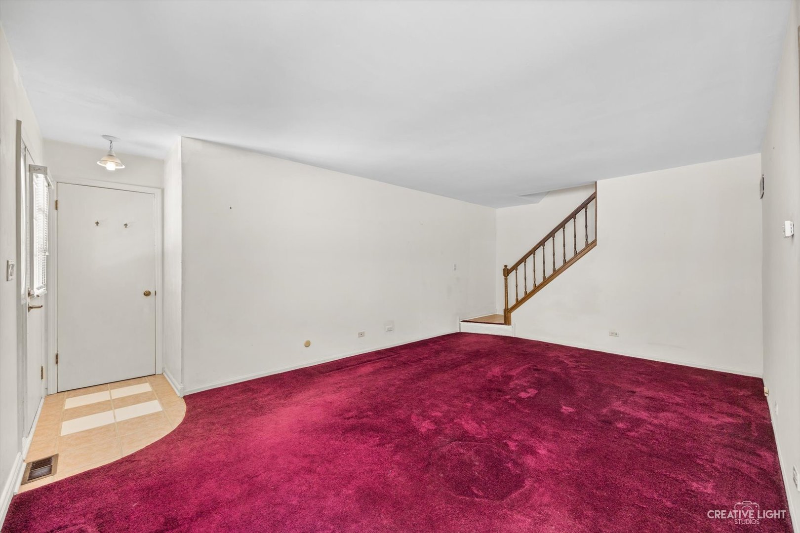 1520 Timber Trail, Unit 17B Wheaton, IL 60189 - Photo 6 of 17 a view of an empty room with wooden floor