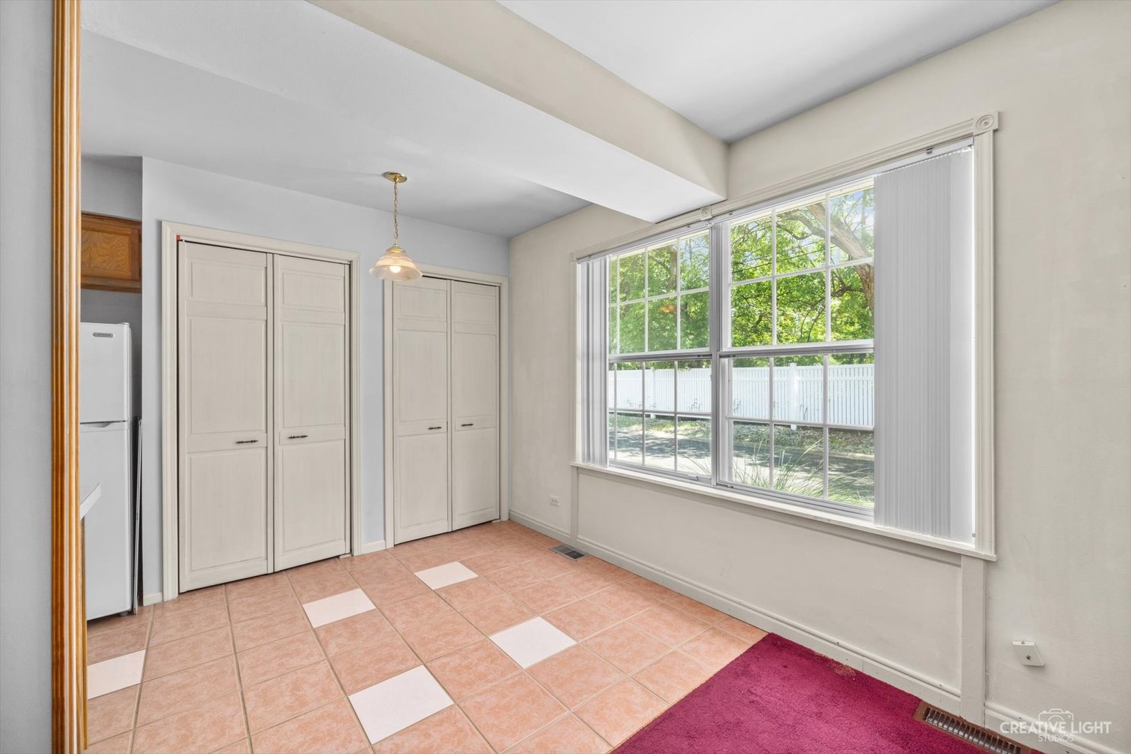 1520 Timber Trail, Unit 17B Wheaton, IL 60189 - Photo 7 of 17 a view of an empty room with a window