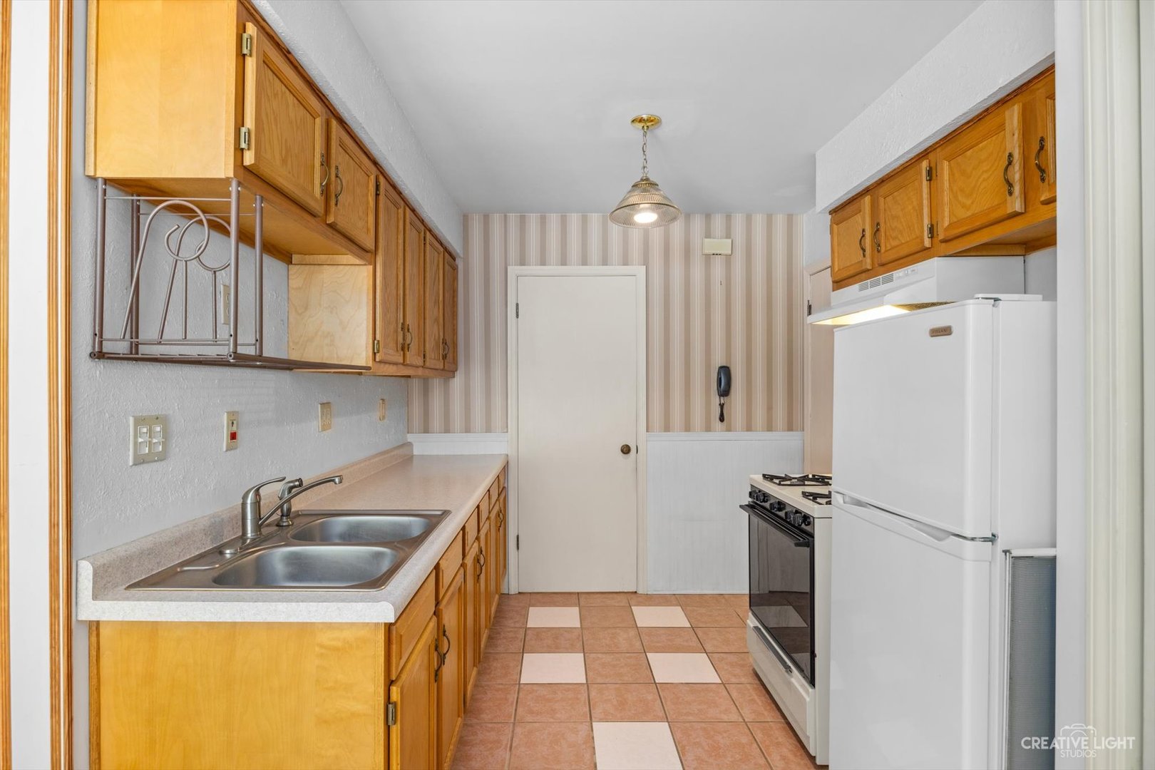 1520 Timber Trail, Unit 17B Wheaton, IL 60189 - Photo 9 of 17 a kitchen with stainless steel appliances granite countertop a refrigerator a sink and a stove
