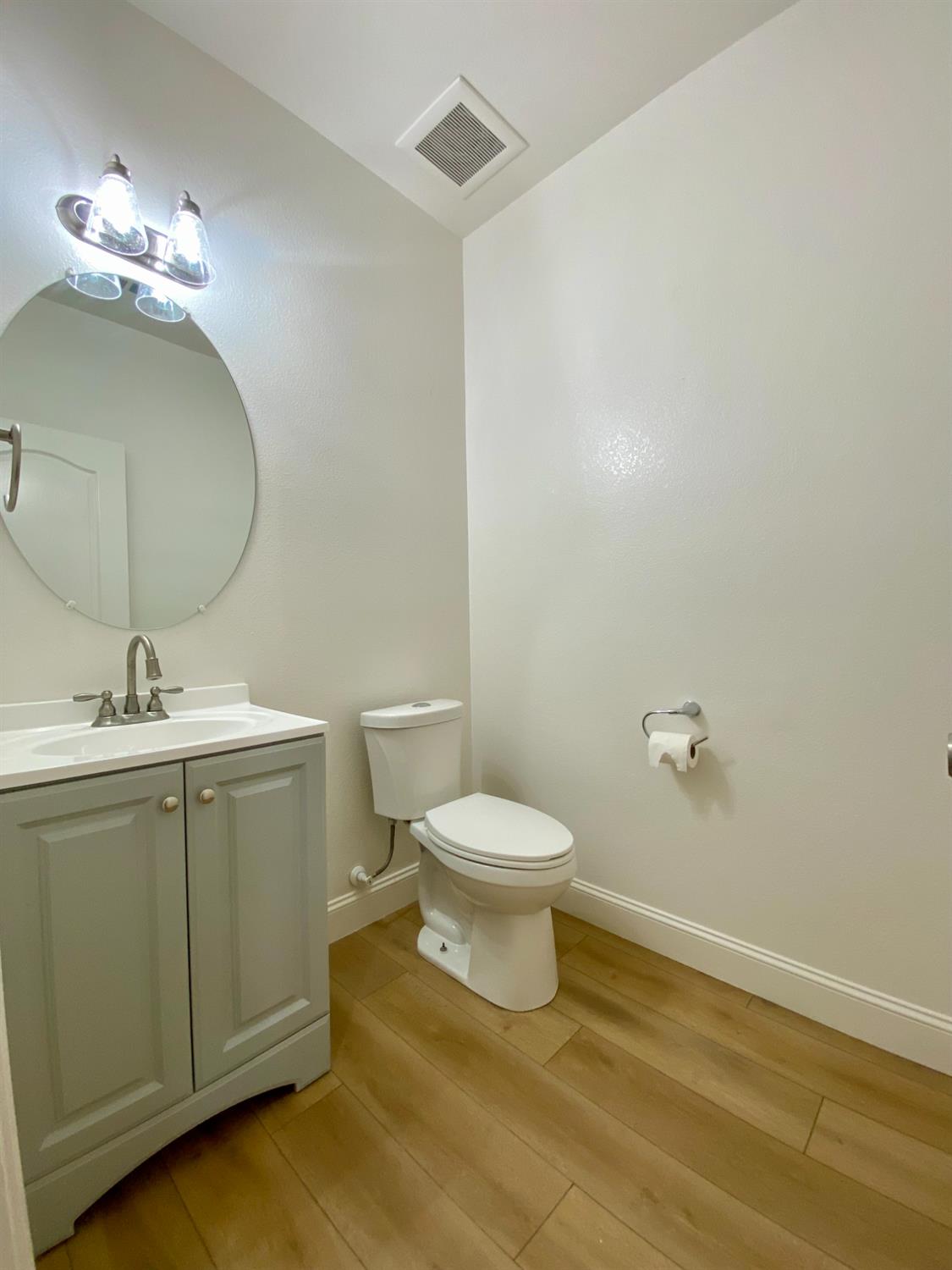 1227 CAVALAIRE Court Merced, CA 95348 - Photo 12 of 34 a bathroom with a toilet sink and mirror
