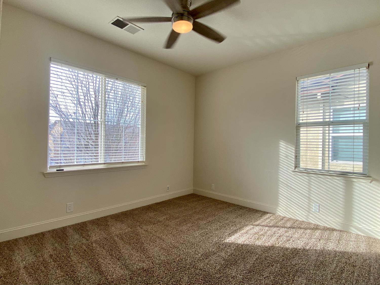 1227 CAVALAIRE Court Merced, CA 95348 - Photo 16 of 34 a view of an empty room with a window