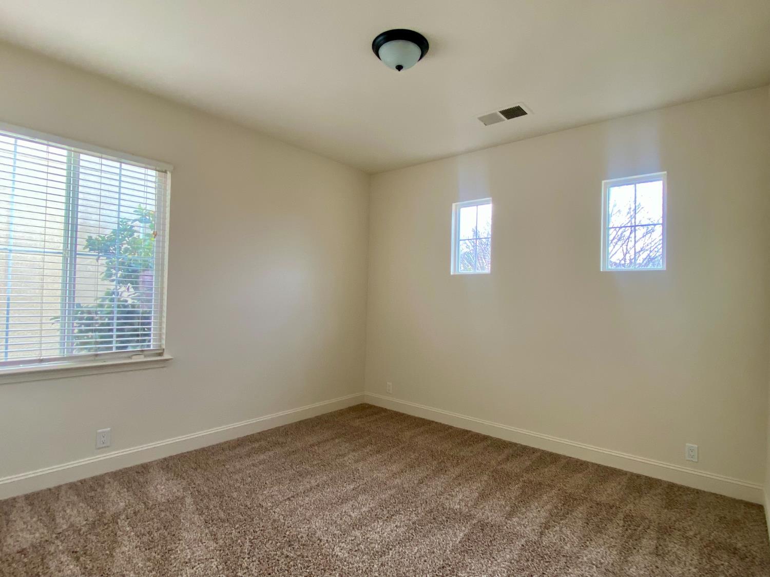 1227 CAVALAIRE Court Merced, CA 95348 - Photo 19 of 34 an empty room with a window