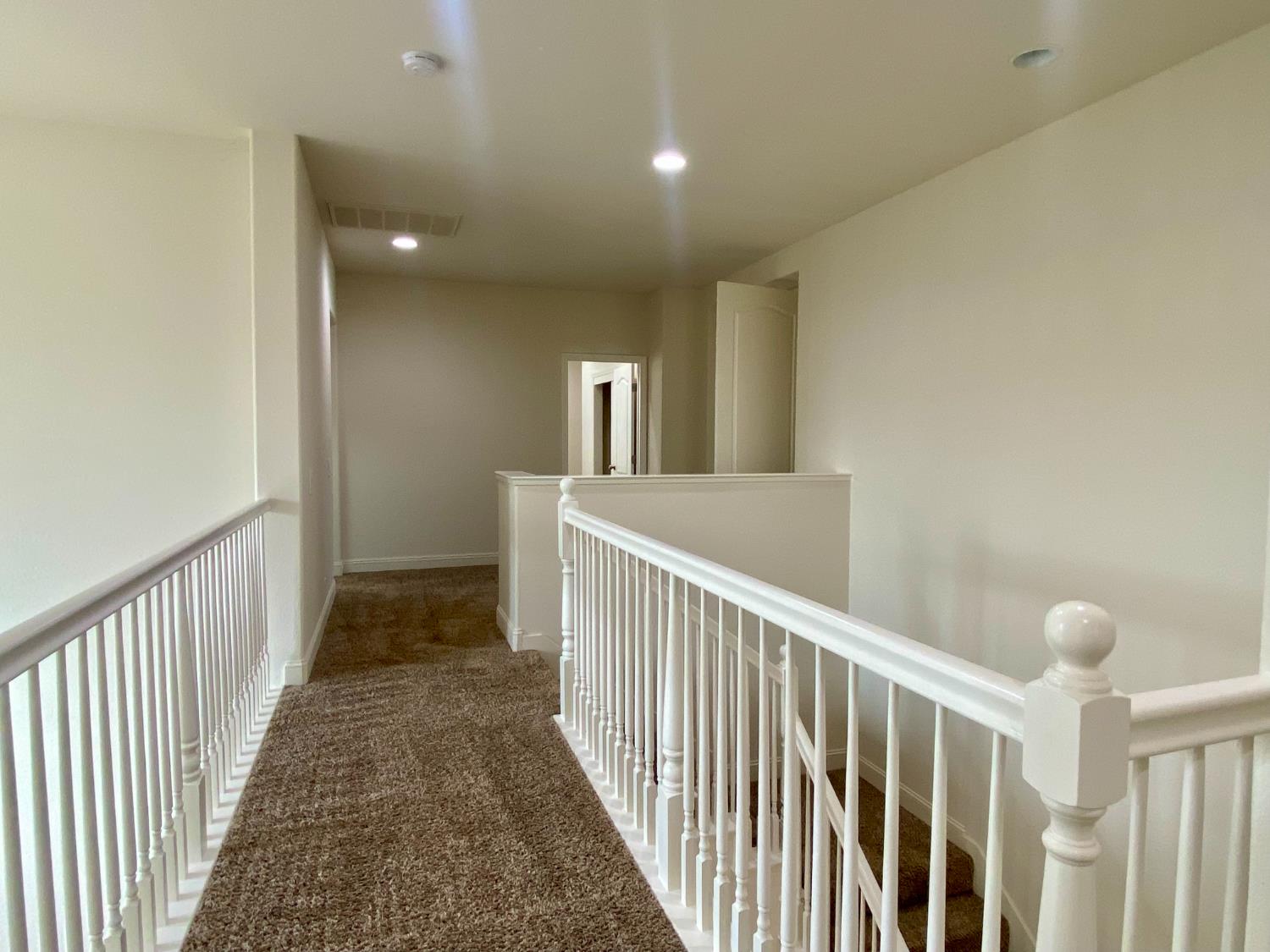1227 CAVALAIRE Court Merced, CA 95348 - Photo 21 of 34 a view of a hallway view with staircase