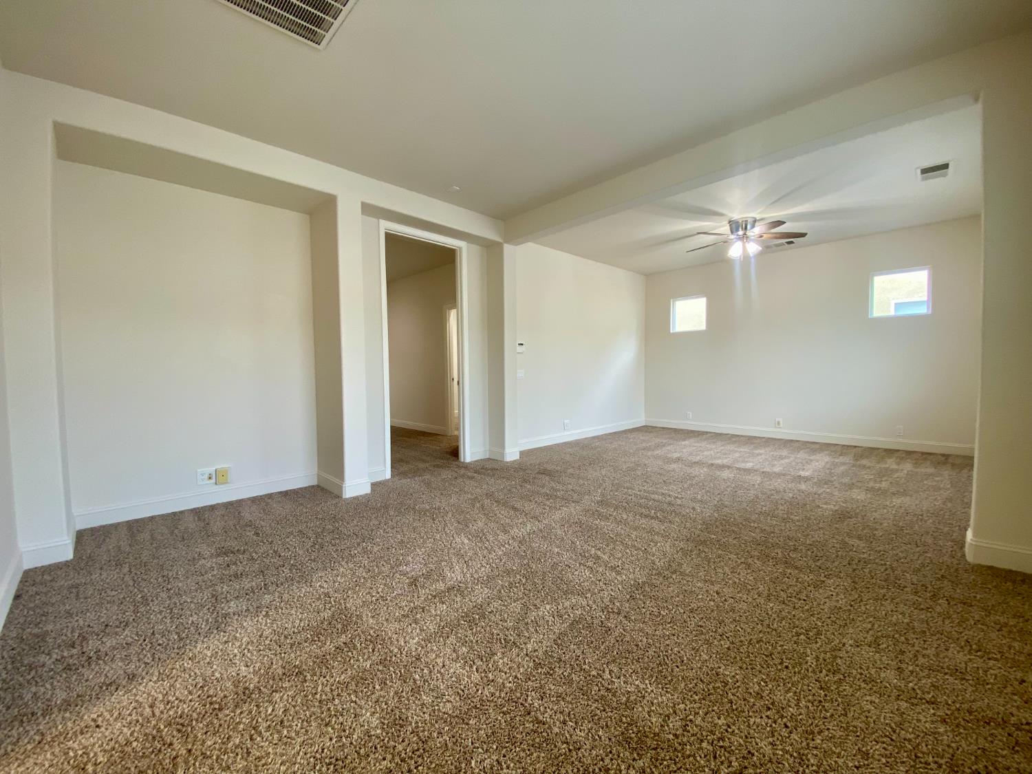 1227 CAVALAIRE Court Merced, CA 95348 - Photo 24 of 34 a view of a livingroom with a ceiling fan and window