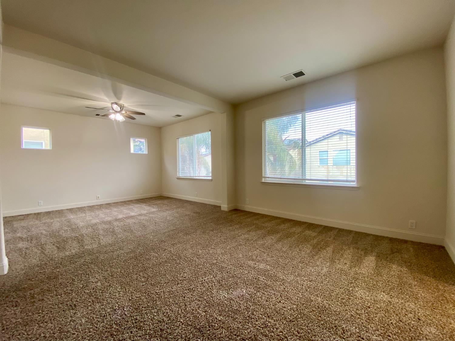 1227 CAVALAIRE Court Merced, CA 95348 - Photo 25 of 34 a view of an empty room with a window