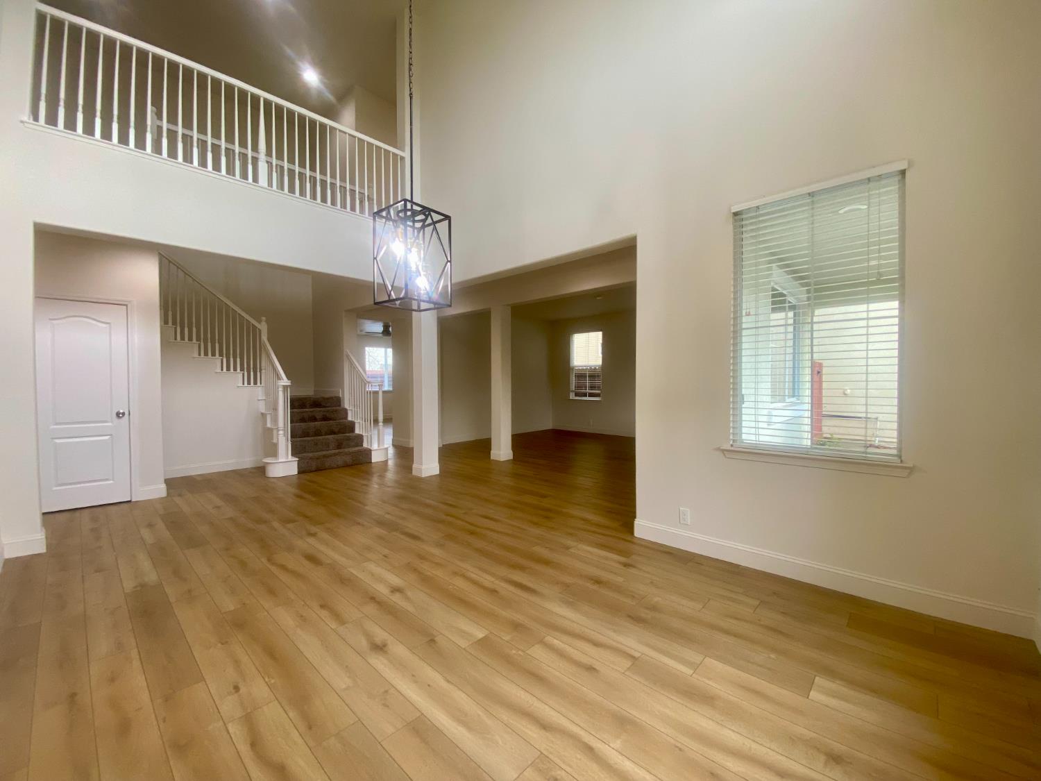 1227 CAVALAIRE Court Merced, CA 95348 - Photo 3 of 34 a view of empty room with wooden floor