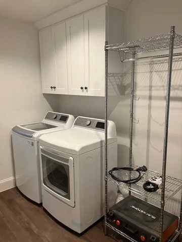 a bathroom with a granite countertop toilet sink and mirror