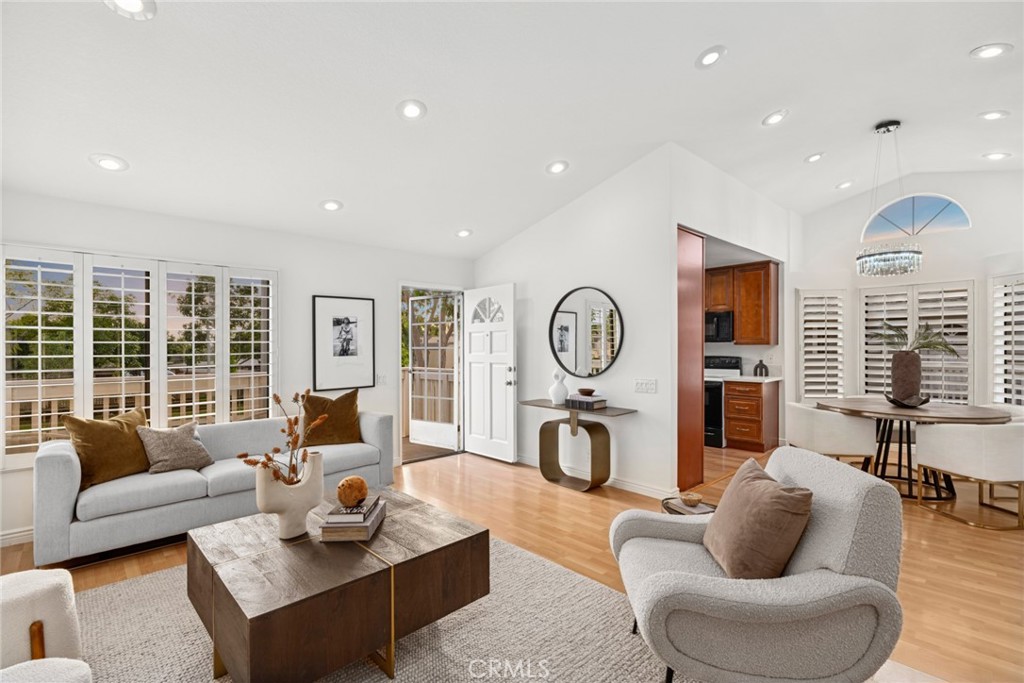 127 Huntington Irvine, CA 92620 - Photo 1 of 1 a living room with furniture a rug a fireplace and a large window