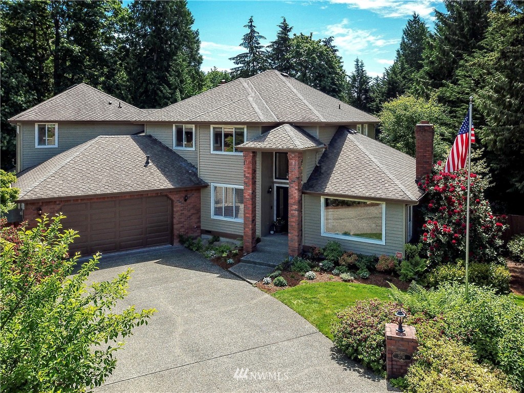 2716 187th Street Southeast Bothell, WA 98012 - Photo 1 of 37 a front view of a house with a yard