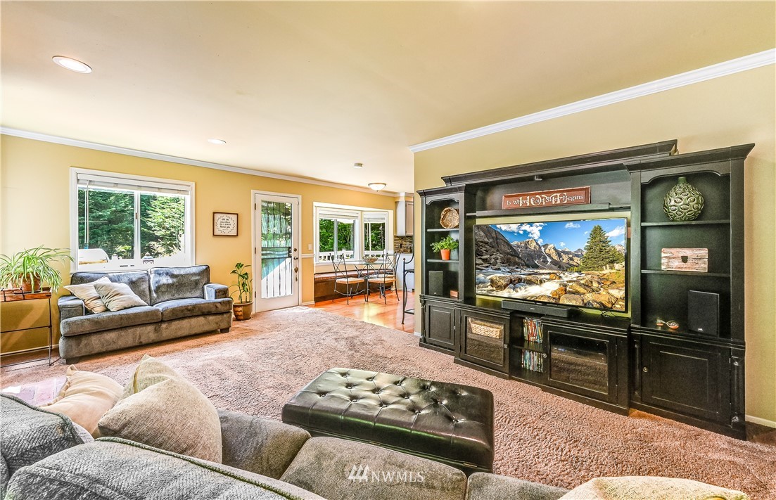 2716 187th Street Southeast Bothell, WA 98012 - Photo 12 of 37 a living room with furniture and a flat screen tv