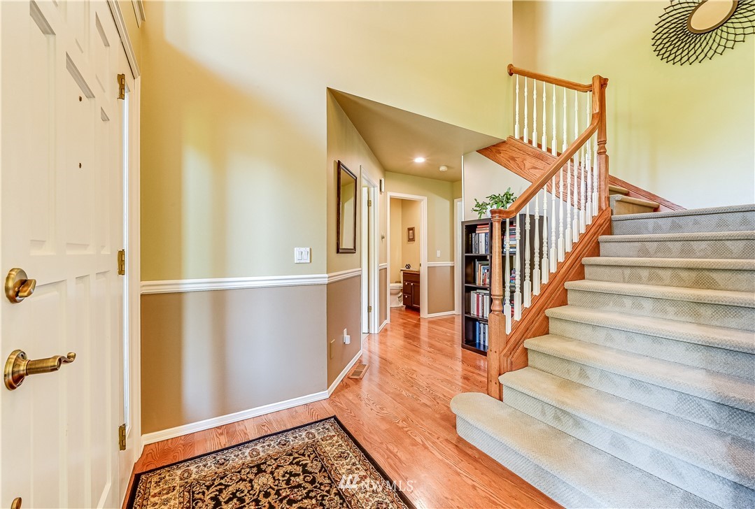 2716 187th Street Southeast Bothell, WA 98012 - Photo 15 of 37 a view of entryway with wooden floor