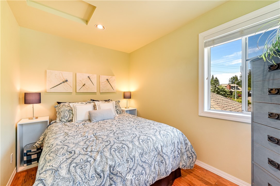 2716 187th Street Southeast Bothell, WA 98012 - Photo 20 of 37 a bedroom with a bed and a night stand