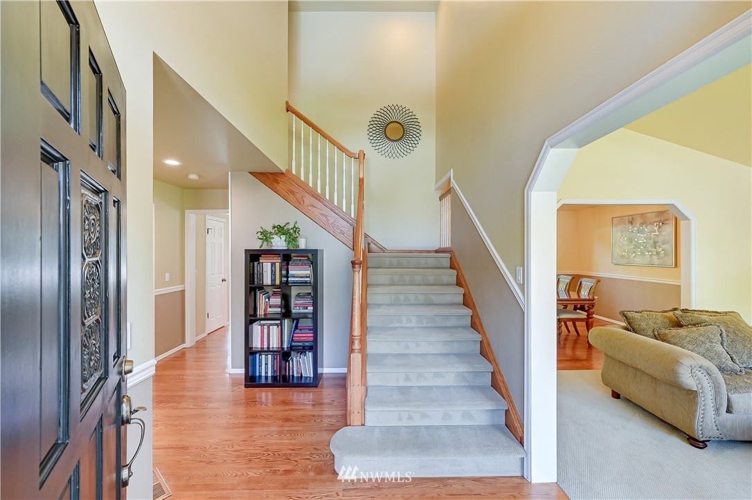 2716 187th Street Southeast Bothell, WA 98012 - Photo 3 of 37 a view of entryway and hall with wooden floor