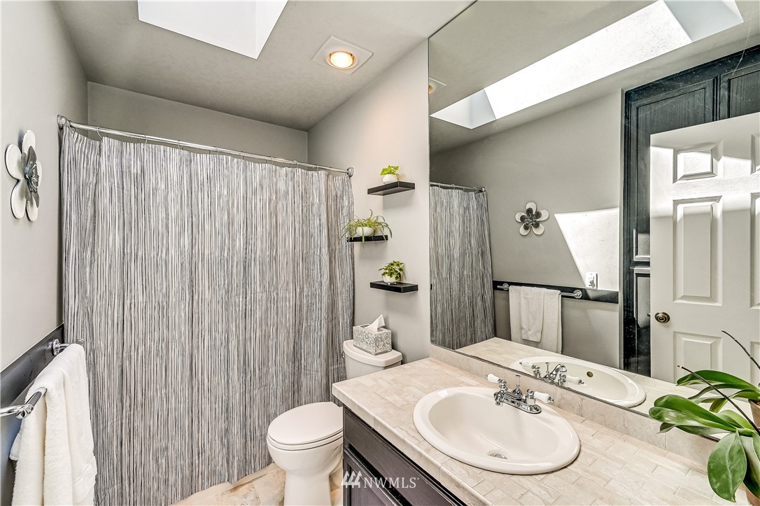 2716 187th Street Southeast Bothell, WA 98012 - Photo 21 of 37 a bathroom with a sink toilet and shower