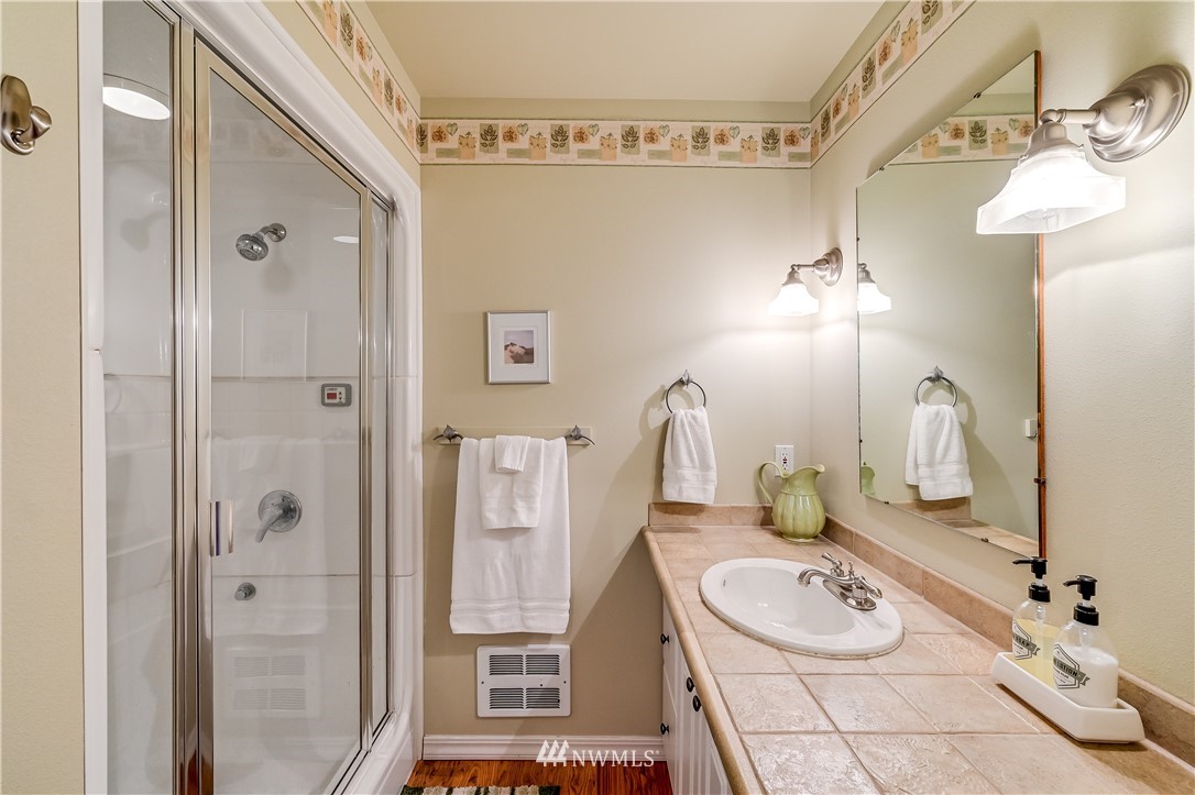 2716 187th Street Southeast Bothell, WA 98012 - Photo 24 of 37 a bathroom with a sink double vanity and tub