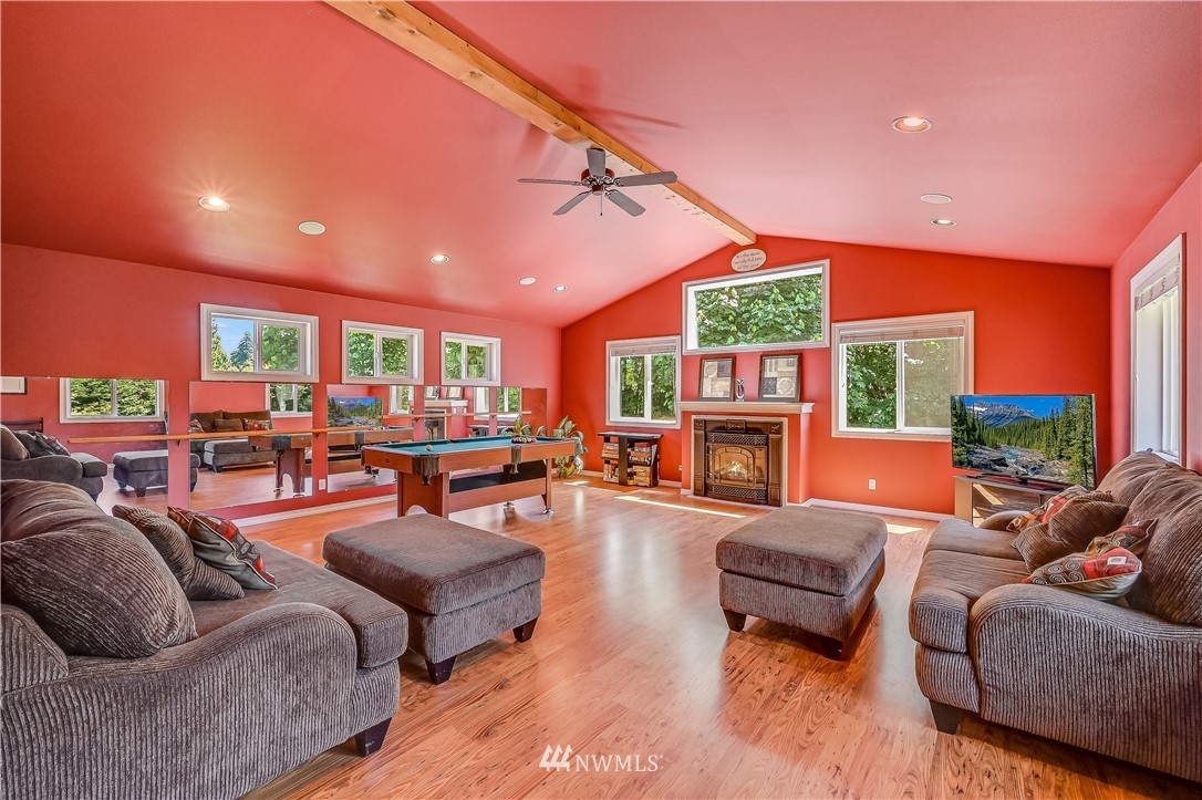 2716 187th Street Southeast Bothell, WA 98012 - Photo 25 of 37 a living room with fireplace furniture and a fireplace