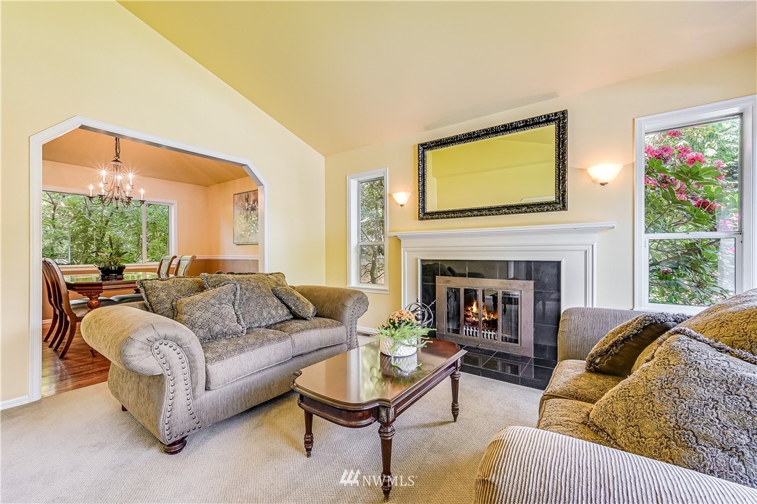 2716 187th Street Southeast Bothell, WA 98012 - Photo 4 of 37 a living room with furniture and a fireplace