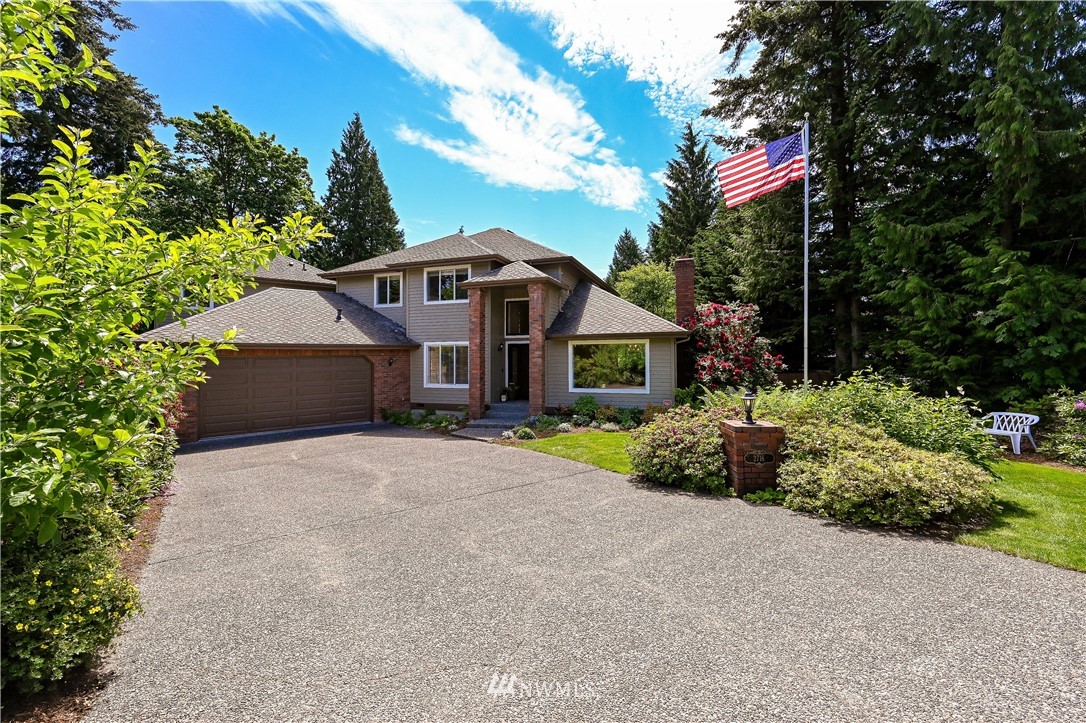 2716 187th Street Southeast Bothell, WA 98012 - Photo 37 of 37 a front view of a house with a garden