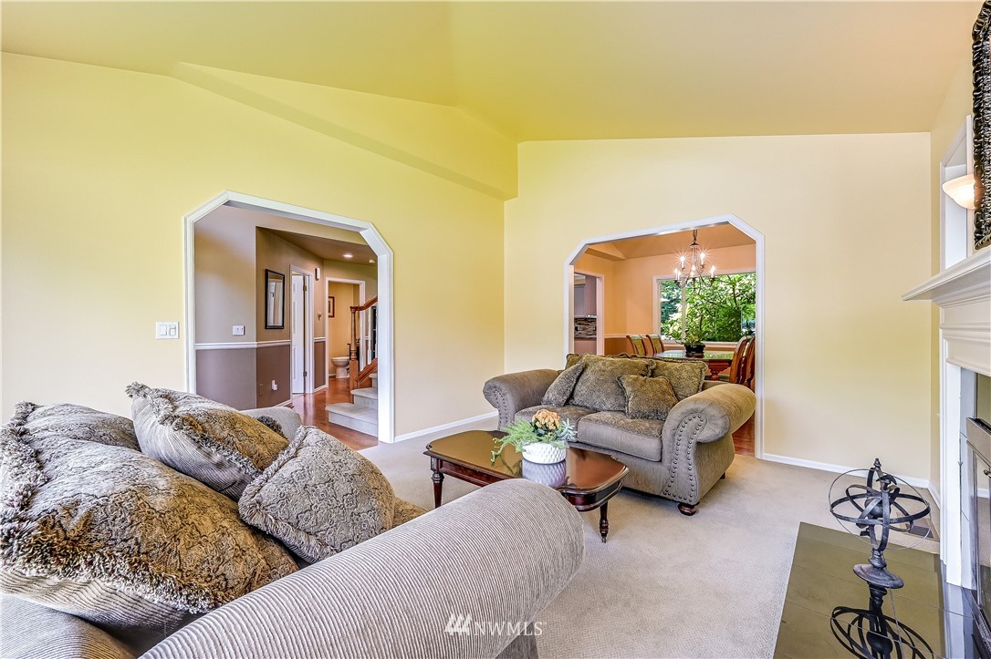 2716 187th Street Southeast Bothell, WA 98012 - Photo 5 of 37 a living room with furniture and a table